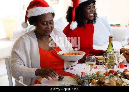 Multi generation african american family in dining room Stock Photo