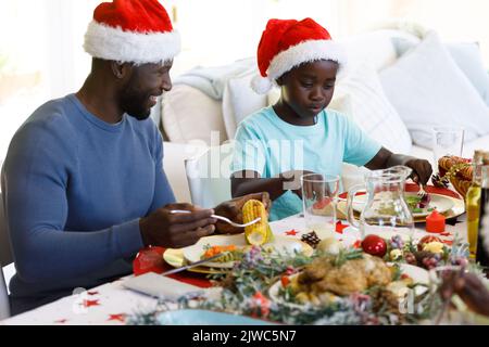 Multi generation african american family in dining room Stock Photo