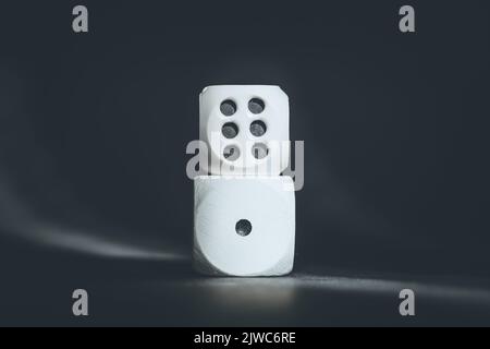 Two dices with number one and number six. Minimum and maximum. Cubes placed one on top of the other. Good luck in casino games. Board game dices. Stock Photo