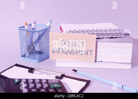 Hand writing sign Project Improvement. Business overview Methods Techniques to accomplish a defined Objective Stock Photo