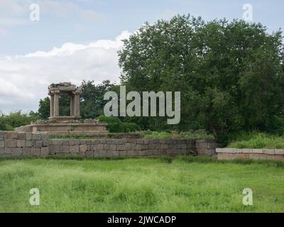 Water pool for public bath and sports near a stepped square water tank at Hampi state Karnataka India 08 07 2022 Stock Photo