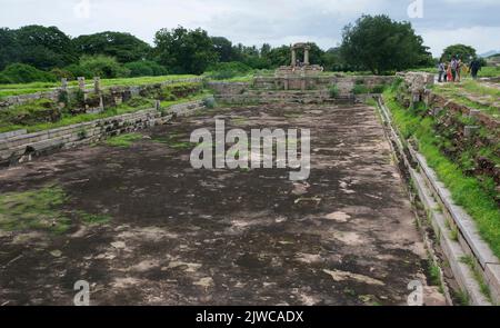 Water pool for public bath and sports near a stepped square water tank at Hampi state Karnataka India 08 07 2022 Stock Photo