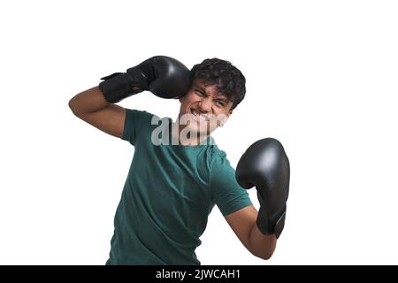 Young peruvian boxer throwing a chopping right, isolated. Stock Photo