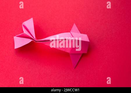 Pink paper fish origami isolated on a blank white background Stock ...