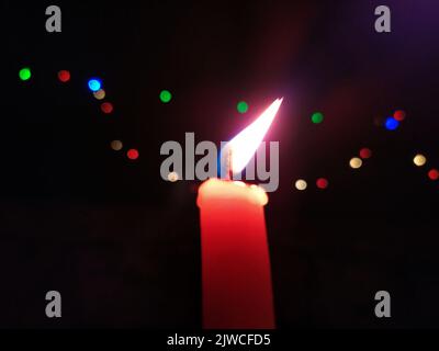 a candal flame is lightning in very dark night Stock Photo