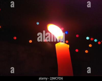 a candal flame is lightning in very dark night Stock Photo