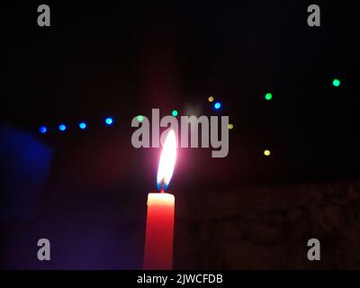 a candal flame is lightning in very dark night Stock Photo