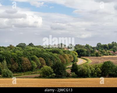 Summer view over the English countryside with the village of Castle Ashby in the distance, Northamptonshire, UK Stock Photo