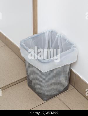 Close up of small trash can with recyclable garbage bag. Stock Photo