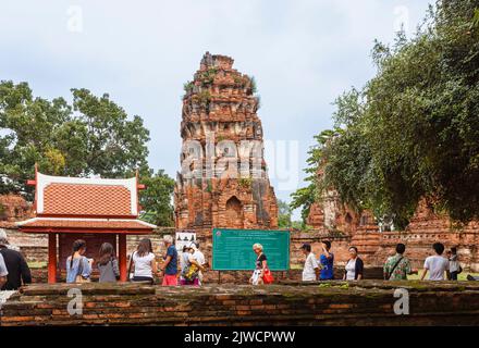 Prang by the entrance to the ruins of Wat Maha That, the sacred royal temple in Ayutthaya, Thailand Stock Photo