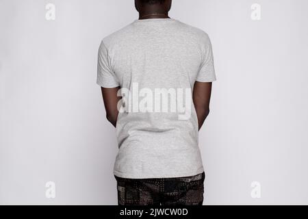 black model wearing a plain grey t-shirt back view Stock Photo