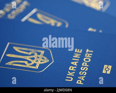 Ukrainian biometric passport id to travel the Europe without visas on the table. Inscription in Ukrainian "Ukraine Passport" Stock Photo