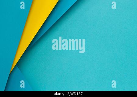 Abstract color papers geometry flat lay composition background with light blue and yellow tones. Top view Stock Photo