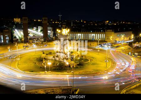 A high angle of traffic lights illuminating a square in Barcelona, Spain shot in long exposure Stock Photo