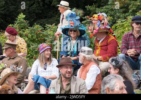 People enjoy dressing up at the Bridport Hat Festival Dorset 2022 Stock Photo