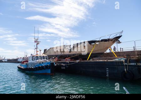 The Rendezvous, the remains of a multi-million-pound superyacht which was destroyed by fire in Torquay Harbour Stock Photo