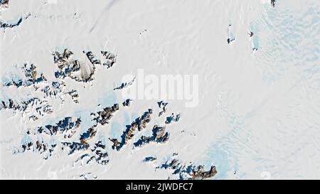 Meteorite in Antarctica, top view of snow rock peaks background texture. Elements of this image furnished by NASA. Stock Photo