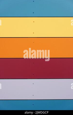 multicolored wall cladding background with horizontal panels Stock Photo