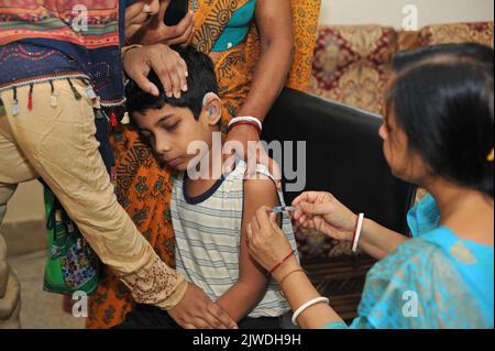 September 4,  2022, Sylhet, Bangladesh: A child of Ragib Rabeya Institute for the Disabled receives a covid-19 dose during a vaccination campaign against virus. on September 4, 2022 in Sylhet, Bangladesh. (Credit Image: © Md Rafayat Haque Khan Eyepix G/eyepix via ZUMA Press Wire) Stock Photo