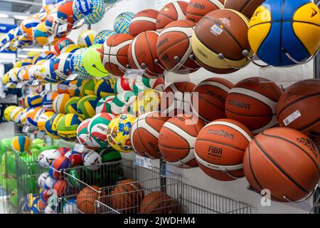 SAINT PETERSBURG, RUSSIA - AUGUST 14, 2022: new basketballs on shelf Stock Photo