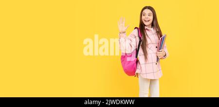 back to school. hello or goodbuy. teen girl in checkered shirt. happy kid waving hand. Portrait of schoolgirl student, studio banner header. School Stock Photo