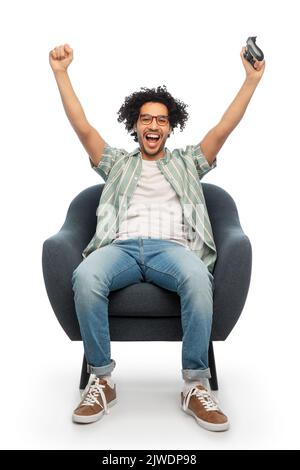 happy man with gamepad playing video game Stock Photo
