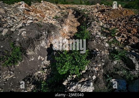 ZAPORIZHZHIA REGION, UKRAINE - SEPTEMBER 02, 2022 - Stony ground is seen at one of the positions of the Ukrainian Armed Forces, where they improve defensive facilities by installing metal bunkers, Zaporizhzhia, south-eastern Ukraine. Stock Photo