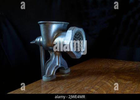 A home tool for meat processing. Kitchen items on a black background Stock Photo