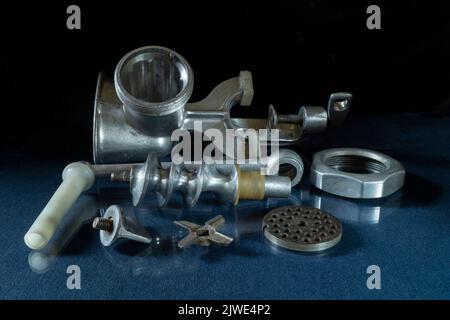 Kitchen equipment on a black background. Hand tool for meat processing close-up Stock Photo