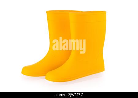 Yellow rubber boots isolated on white background. Kids shoes. Stock Photo