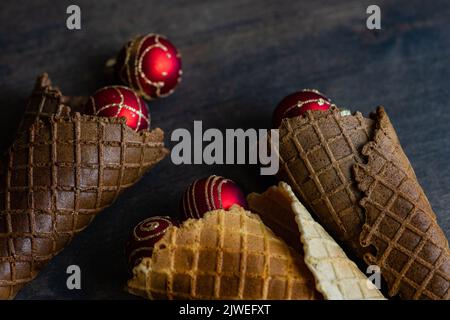 Overhead view of conceptual ice cream cones with Christmas baubles Stock Photo