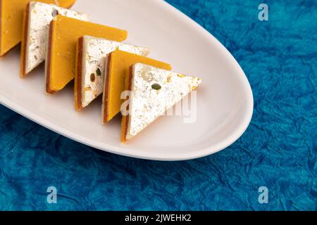 Indian Mithai Kaju Kesar Choco Gulkand Sandwich Burfi Also Known As Kajoo Barfi Is Diamond Shaped Sweet Made Of Cashew Nuts, Chocolate, Saffron, Mawa, Stock Photo