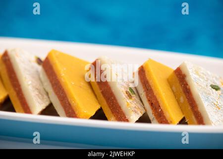 Indian Mithai Kaju Kesar Choco Gulkand Sandwich Burfi Also Known As Kajoo Barfi Is Diamond Shaped Sweet Made Of Cashew Nuts, Chocolate, Saffron, Mawa, Stock Photo