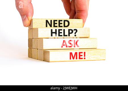 Support and need help ask me symbol. Concept words Need help ask me on wooden blocks on a beautiful white table white background. Businessman hand. Bu Stock Photo