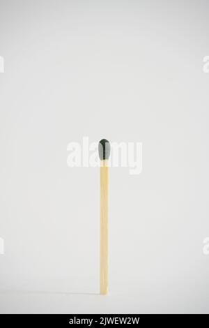 A match with green head on a white background Stock Photo