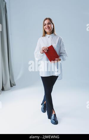 Red notebook for business notes. Women's case notebook Stock Photo