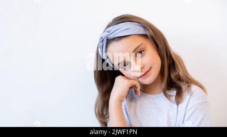 thoughtful kid portrait daydreaming cute girl face Stock Photo