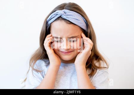 kid migraine tension headache suffering girl pain Stock Photo