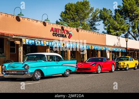 Light blue 1957 Chevrolet Bel Air, Red Corvette Stingray, Yellow Ford Mustang parked in front of Anita's Cocina Mexican Restaurant in Wickenburg, Ariz Stock Photo