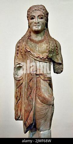 Ancient Greek Archaic statuette of a kore, Acropolis Athens, 500-490 BC National Archaeological Museum in Athens. Stock Photo