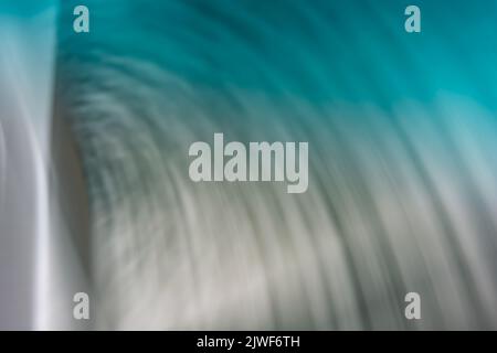 Gray-turquoise ripples, abstraction from small waves. Abstraction water. Backdrop Stock Photo
