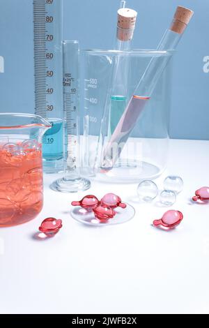 Serum capsules for healthy skin. Skin care and supplements for clear and radiant skin. Equipment and science experiments in the laboratory. Stock Photo