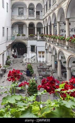 Italian courtyard in Lviv, Ukraine decorated with flowers Stock Photo