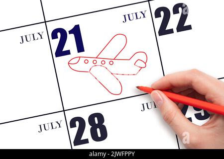 21st day ofJuly. A hand drawing outline of airplane on calendar date 21 July. The date of flight on plane. Travel, business trips. Summer month. Day o Stock Photo