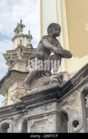 Unidentified busking mime in the retro costume with umbrella on street of Lviv, Ukraine Stock Photo