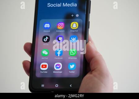 Exeter, UK - September 2022: Social media apps displayed on a smartphone, including Facebook, TikTok, Instagram, Twitter and others Stock Photo