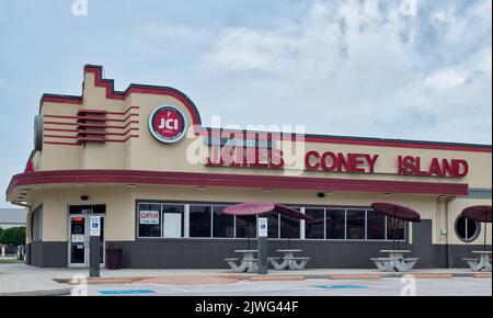 Houston, Texas USA 12-03-2021: James Coney Island restaurant exterior and parking lot in Houston, TX. Fast food chain founded in 1923. Stock Photo