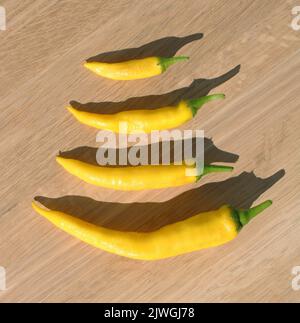 A Group of Yellow Hot Peppers of Different Lengths Stock Photo