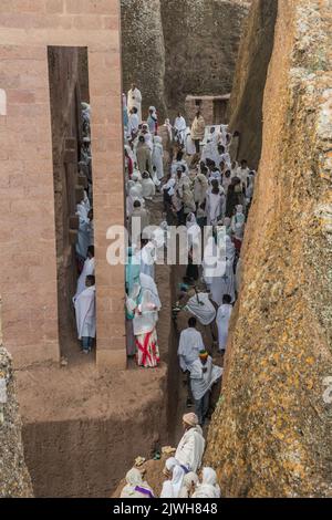 LALIBELA, ETHIOPIA - MARCH 31, 2019: Group of devotees during the Sunday service at Bet Medhane Alem, rock-hewn church in Lalibela, Ethiopia Stock Photo