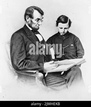 1864 photo of President Abraham Lincoln with youngest son, Thomas (known as Tad or Thaddeus). Tad Lincoln would die at 18 from unknown causes, possibly tuberculosis Stock Photo